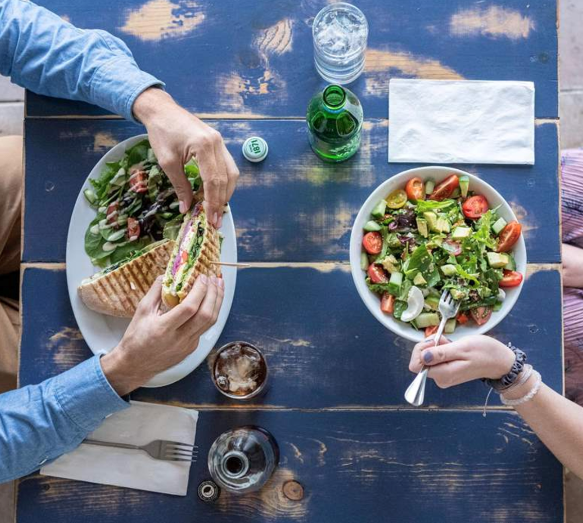 Two people eating food 